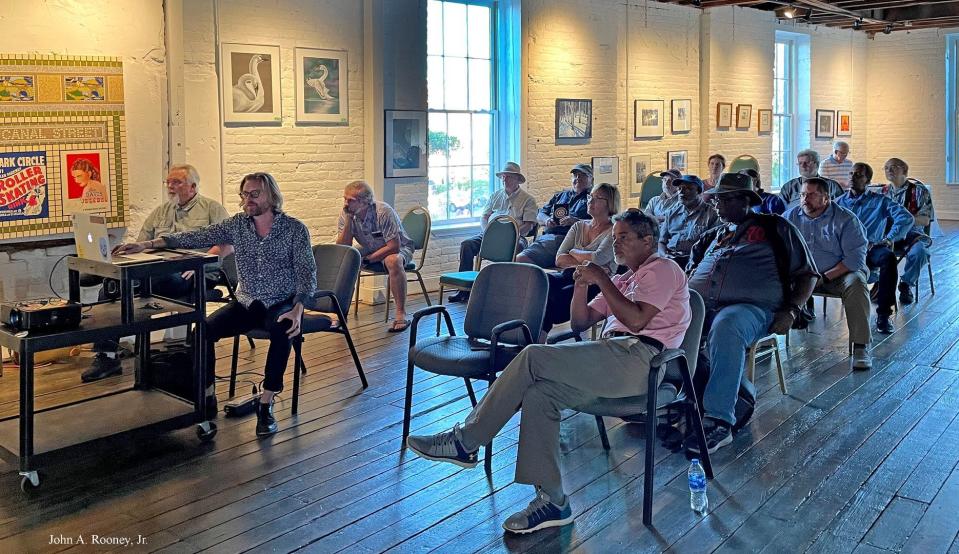 Cockade City Camera Club members watch a slide show presentation during their monthly meeting at Petersburg Area Art league in June 2021.
