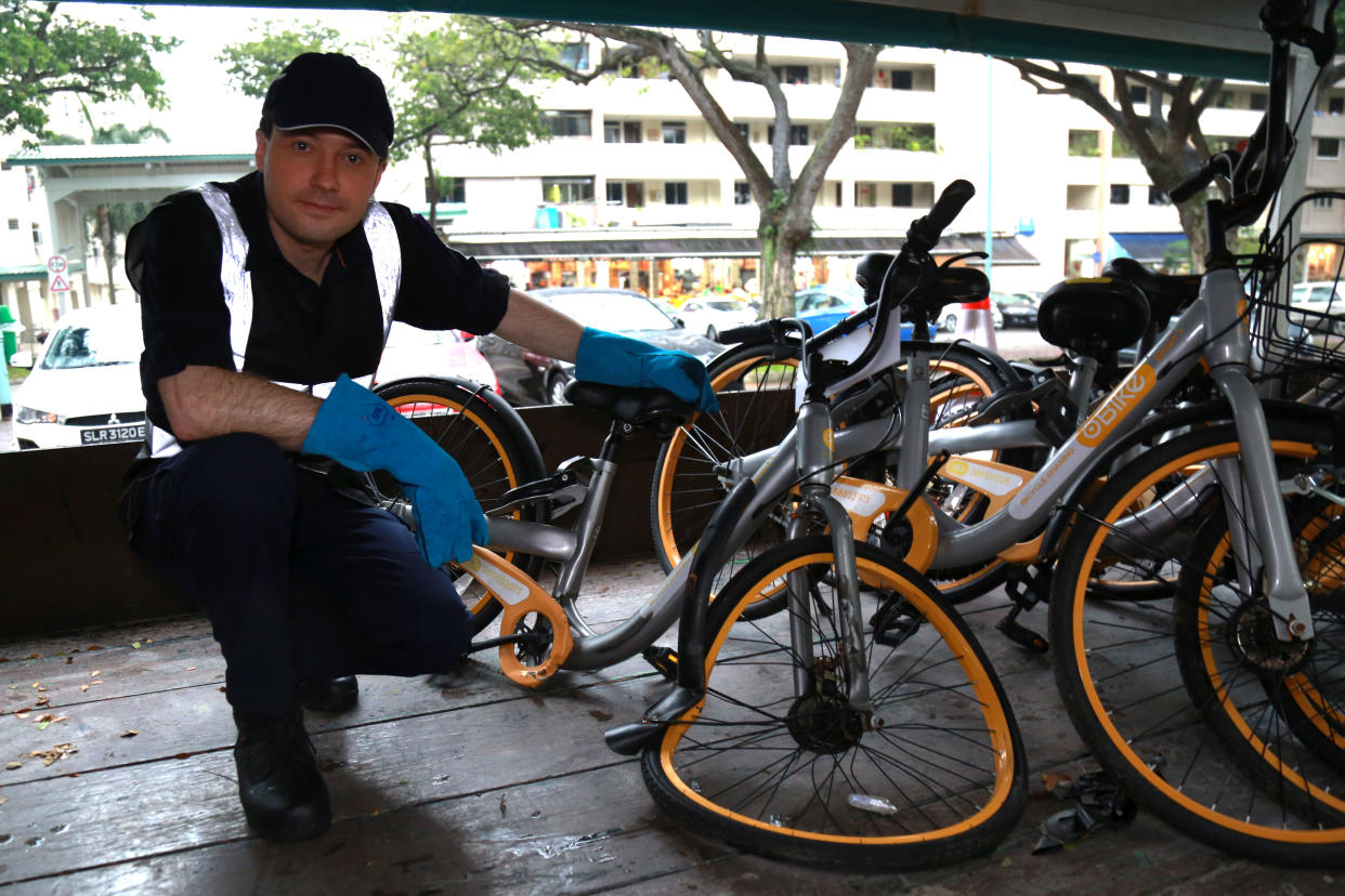 Zhivko Girginov, with one of the spoilt rental bicycles retrieved during a volunteer bike patrol on 12 December. (PHOTO: Dhany Osman / Yahoo News Singapore)