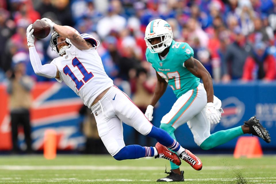 Bills wide receiver Cole Beasley hangs on to the ball in the second half.