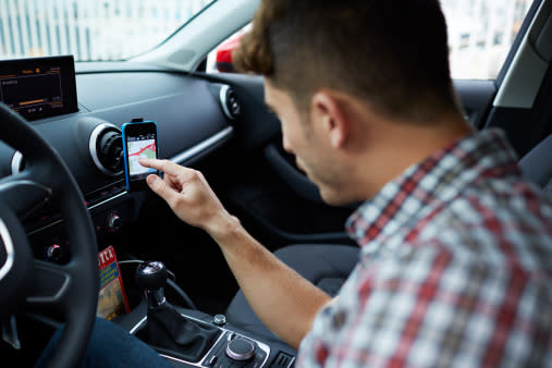 You must be parked with the engine off before adjusting the sat nav on your phone [Getty]