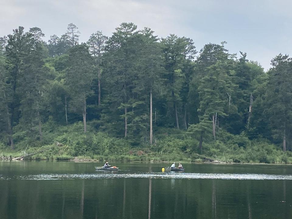 Researchers’ boats on Deming Lake. Elizabeth Swanner, <a href="http://creativecommons.org/licenses/by-nd/4.0/" rel="nofollow noopener" target="_blank" data-ylk="slk:CC BY-ND;elm:context_link;itc:0;sec:content-canvas" class="link ">CC BY-ND</a>