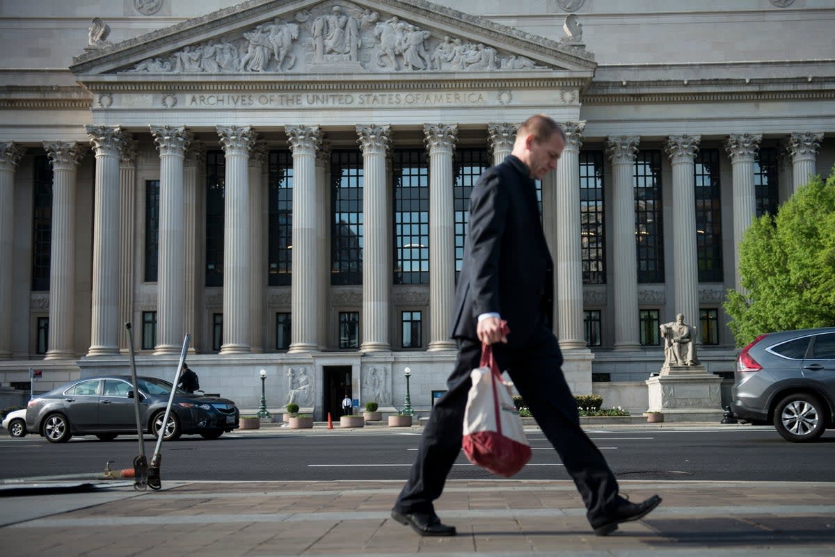 A man walks past the US National Archives and Records Administration headquarters in Washington, DC (AFP/Getty)