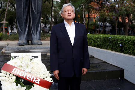 Andres Manuel Lopez Obrador, presidential candidate of the National Regeneration Movement (MORENA), offers a floral tribute to commemorate the 80th anniversary of the expropriation of Mexico's oil industry at Lazaro Cardenas monument in Mexico City, Mexico March 18, 2018. REUTERS/Ginnette Riquelme