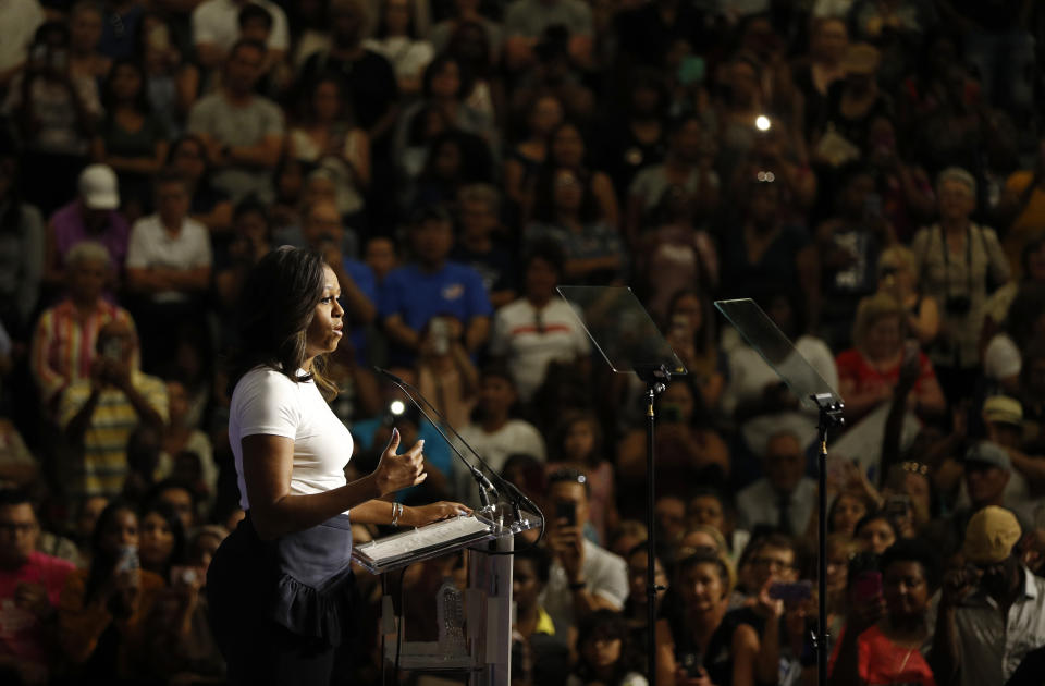 Former first lady Michelle Obama speaks at a rally to encourage voter registration, Sunday, Sept. 23, 2018, in Las Vegas. (AP Photo/John Locher)