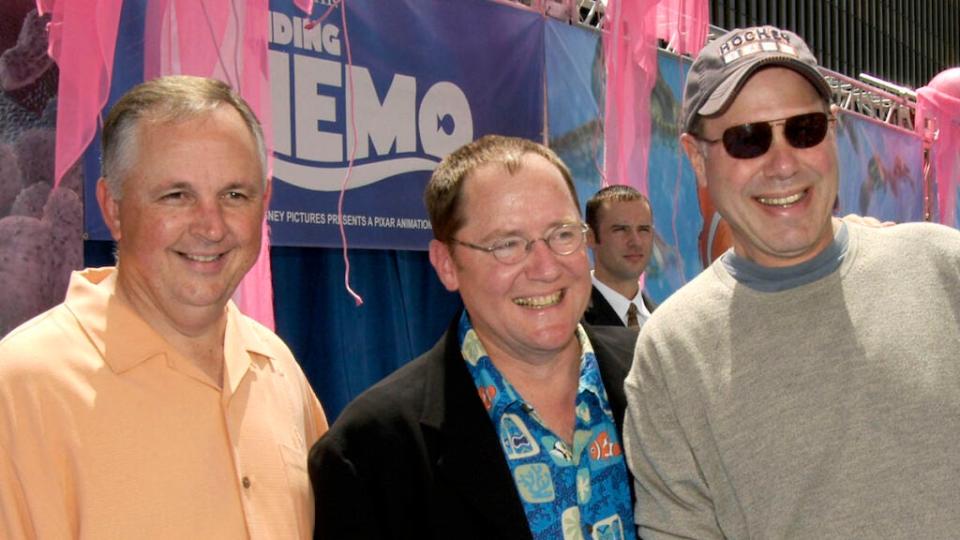 In 2003, Disney CEO Michael Eisner, right, attends the premiere of “Finding Nemo” with Disney executive Dick Cook, left and Pixar executive John Lasseter. The year before, Eisner bashed the movie in a memo to Disney’s board. (Photo by Dan Steinberg/Getty Images)