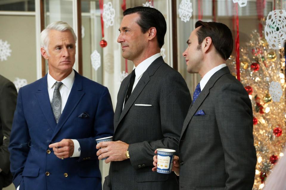 This publicity image released by AMC shows John Slattery as Roger Sterling, left, Jon Hamm as Don Draper, center, and Vincent Kartheiser as Pete Campbell in a scene from the season six premiere of "Mad Men," airing Sunday, April 7, on AMC. (AP Photo/AMC, Michael Yarish)