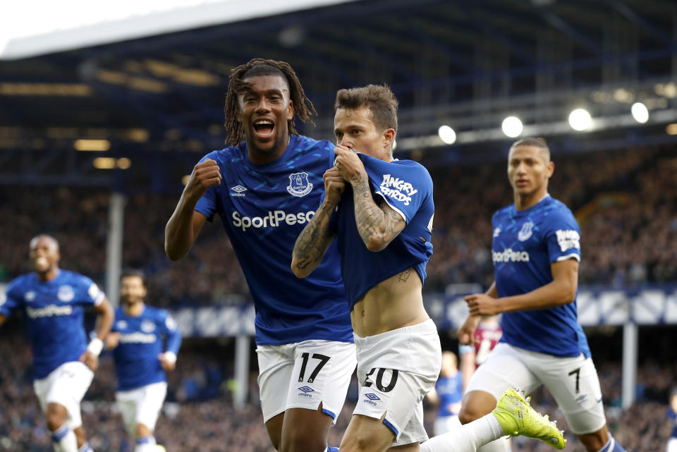 Everton's Bernard (centre) celebrates scoring his side's first goal of the game with team mate Alex Iwobi during the Premier League match at Goodison Park, Liverpool. (Photo by Martin Rickett/PA Images via Getty Images)