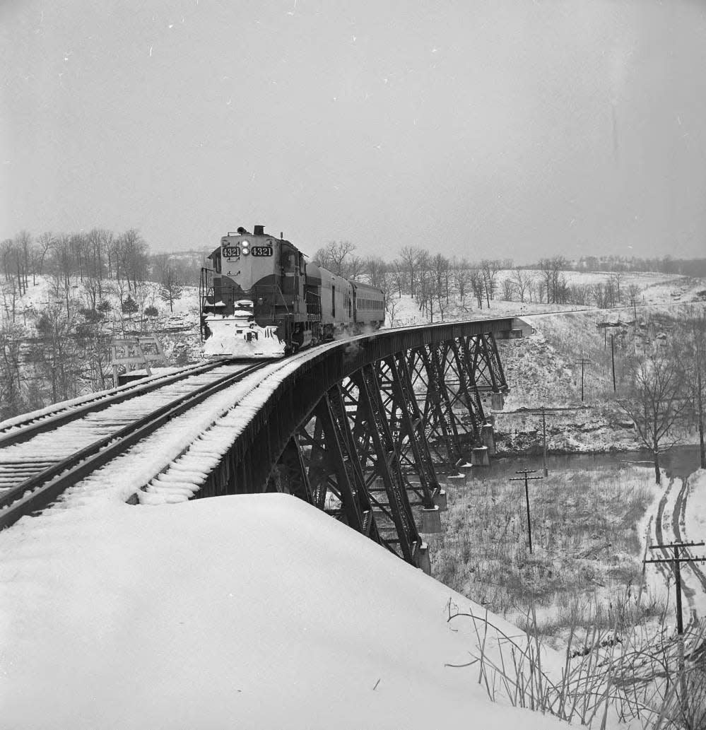 After more than half a century of service, the passenger trains of the Missouri Pacific Railroad on the White River Division closed in March of 1960. The southbound Missouri Pacific passenger train crosses over the Myrtle bridge crossing over Bear Creek north of Bergman, Arkansas in this photo first published in the News & Leader on March 20, 1960.