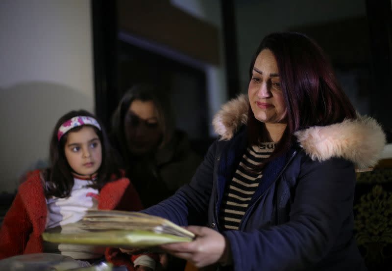 Syrian mother rescues children and a bag of memories from deadly quake