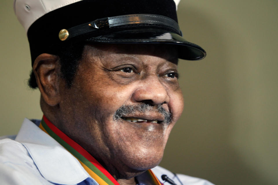 Legendary musician Fats Domino is named "Honorary Grand Marshall" of the Krewe of Orpheus, the star-studded Carnival club that traditionally parades the night before Mardi Gras, Friday, Dec. 20, 2013 in New Orleans. (AP Photo/Doug Parker).