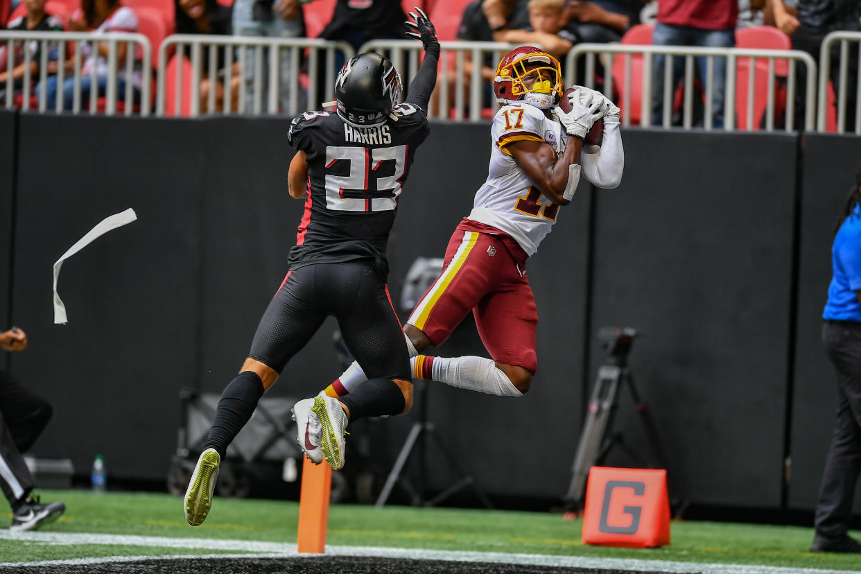 ATLANTA, GA  OCTOBER 03:  Washington wide receiver Terry McLaurin (17) catches a touchdown pass while defended by Atlanta free safety Erik Harris (23) during the NFL game between the Washington Football Team and the Atlanta Falcons on October 3rd, 2021 at Mercedes-Benz Stadium in Atlanta, GA.  (Photo by Rich von Biberstein/Icon Sportswire via Getty Images)