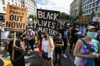 Marchers chant as they gather at Black Lives Matter Plaza near the White House in Washington, during the March on Washington, Friday, Aug. 28, 2020, commemorating the 57th anniversary of the Rev. Martin Luther King Jr.'s "I Have A Dream" speech. (AP Photo/Manuel Balce Ceneta)