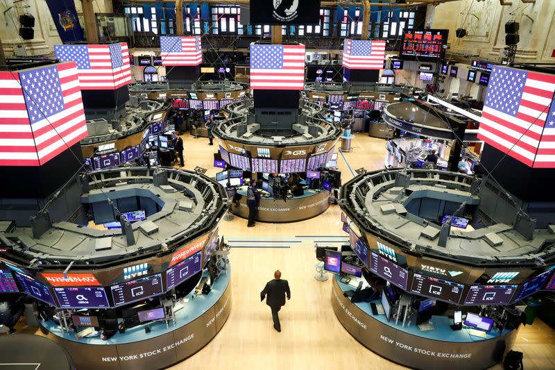 Traders work on the floor of the New York Stock Exchange shortly as coronavirus disease (COVID-19) cases in the city of New York rise