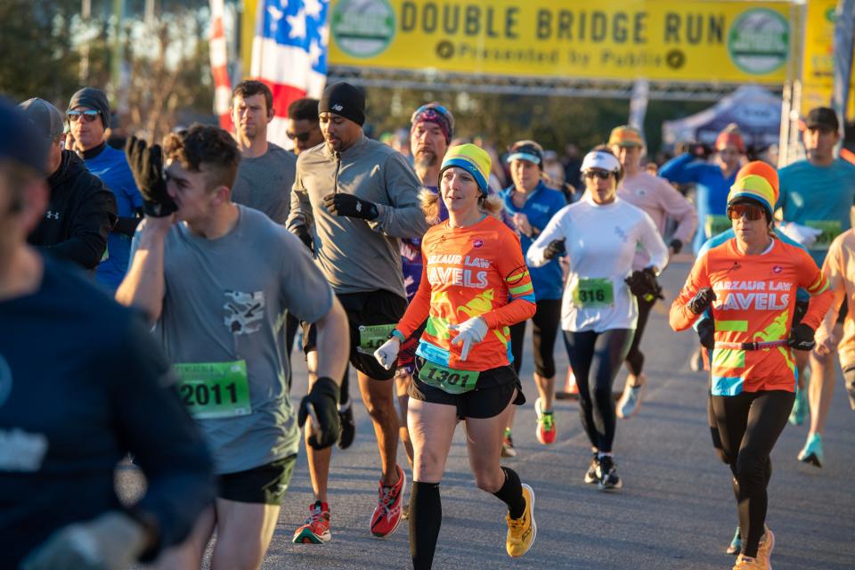 Runners make their way along the route during the Pensacola Double Bridge Run Saturday, February 4, 2023.