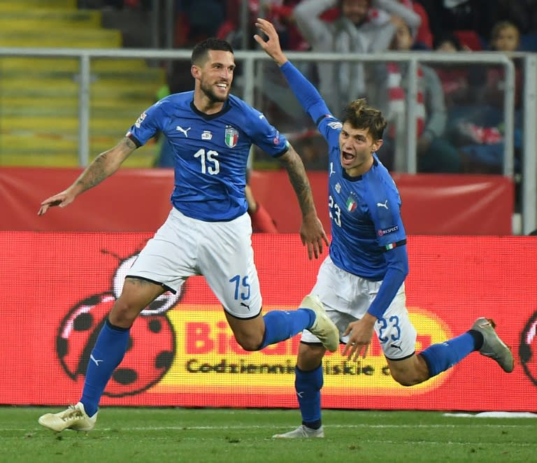 Italy defender Cristiano Biraghi (L) celebrates scoring the winning goal with midfielder Nicolo Barella