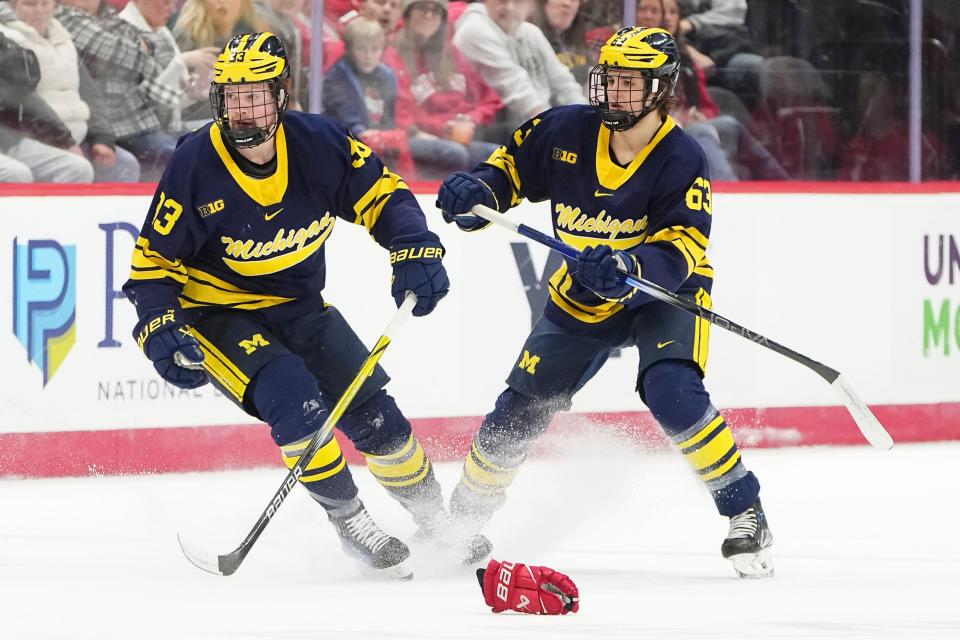 Luca Fantilli, right, is a sophomore defenseman for the Michigan Wolverines.
