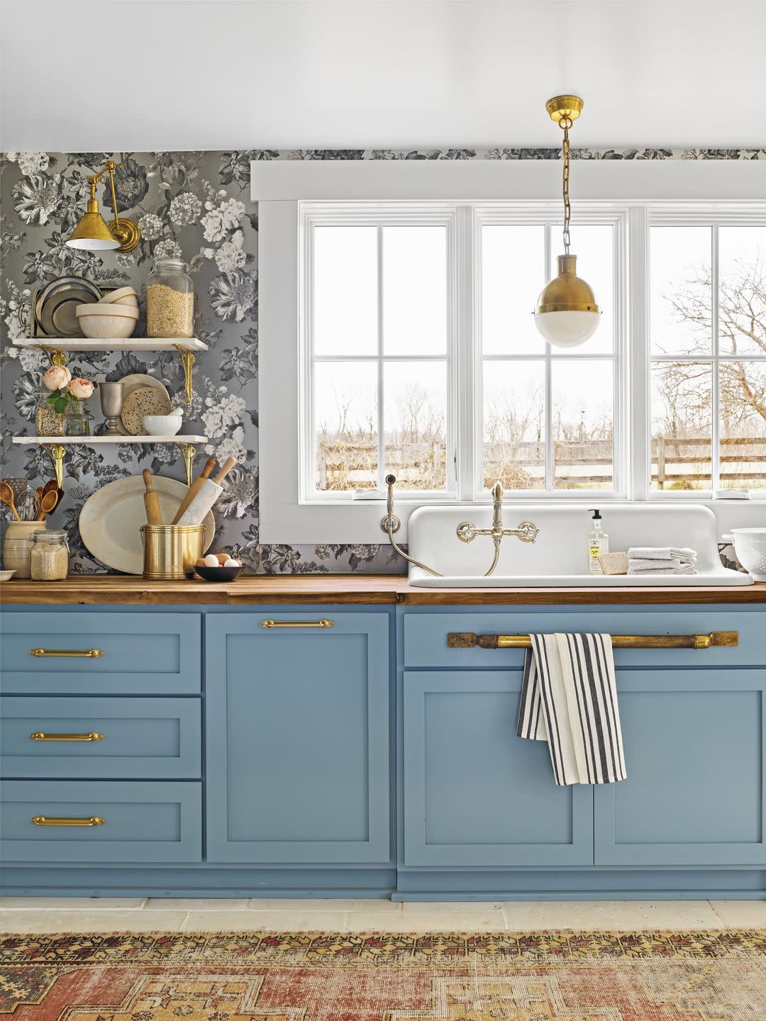 black and white kitchen with blue cabinets