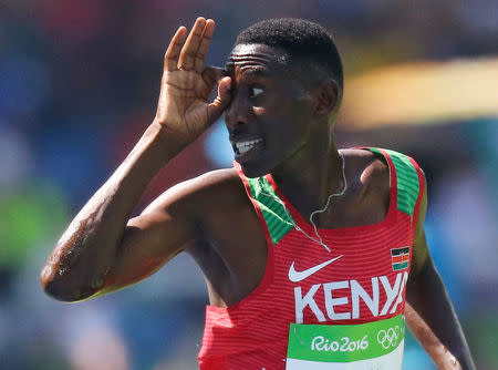 Conseslus Kipruto of Kenya gestures as he crosses the finish line to win the gold in the men's 3000m steeplechase. REUTERS/Ivan Alvarado