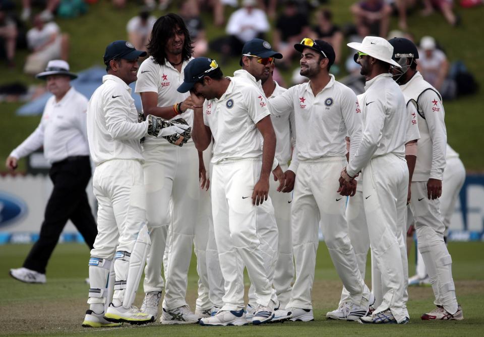 India's players celebrates the dismissal of New Zealan's Peter Fulton during day one of the second international test cricket match at the Basin Reserve in Wellington, February 14, 2014.