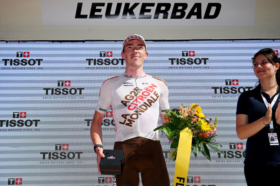 LEUKERBAD SWITZERLAND  JUNE 14 Stan Dewulf of Belgium and Ag2R Citron Team celebrates at podium as most combative rider trophy during the 86th Tour de Suisse 2023 Stage 4 a 1525km stage from Monthey to Leukerbad 1367m  UCIWT  on June 14 2023 in Leukerbad Switzerland Photo by Dario BelingheriGetty Images