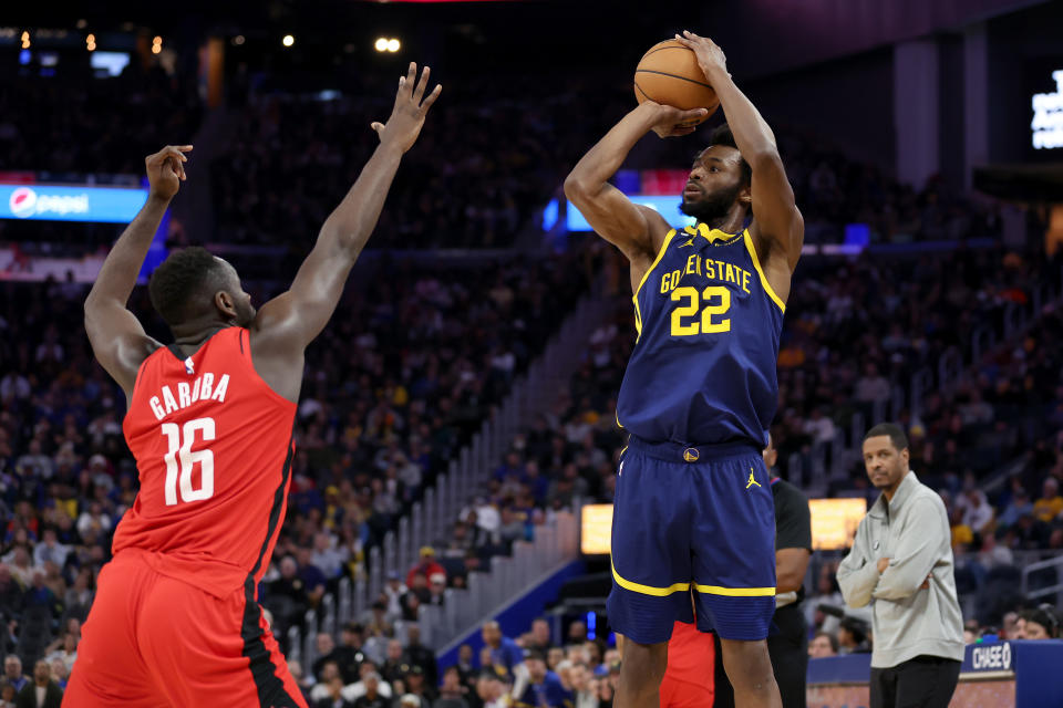 SAN FRANCISCO, CALIFORNIA - DECEMBER 03: Andrew Wiggins #22 of the Golden State Warriors shoots over Usman Garuba #16 of the Houston Rockets at Chase Center on December 03, 2022 in San Francisco, California. NOTE TO USER: User expressly acknowledges and agrees that, by downloading and or using this photograph, User is consenting to the terms and conditions of the Getty Images License Agreement.  (Photo by Ezra Shaw/Getty Images)