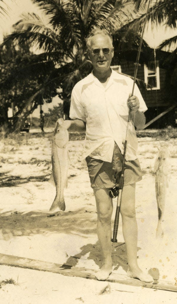 Claude J. Rohn posing with a snook he caught at Fort Myers Beach in 1950.