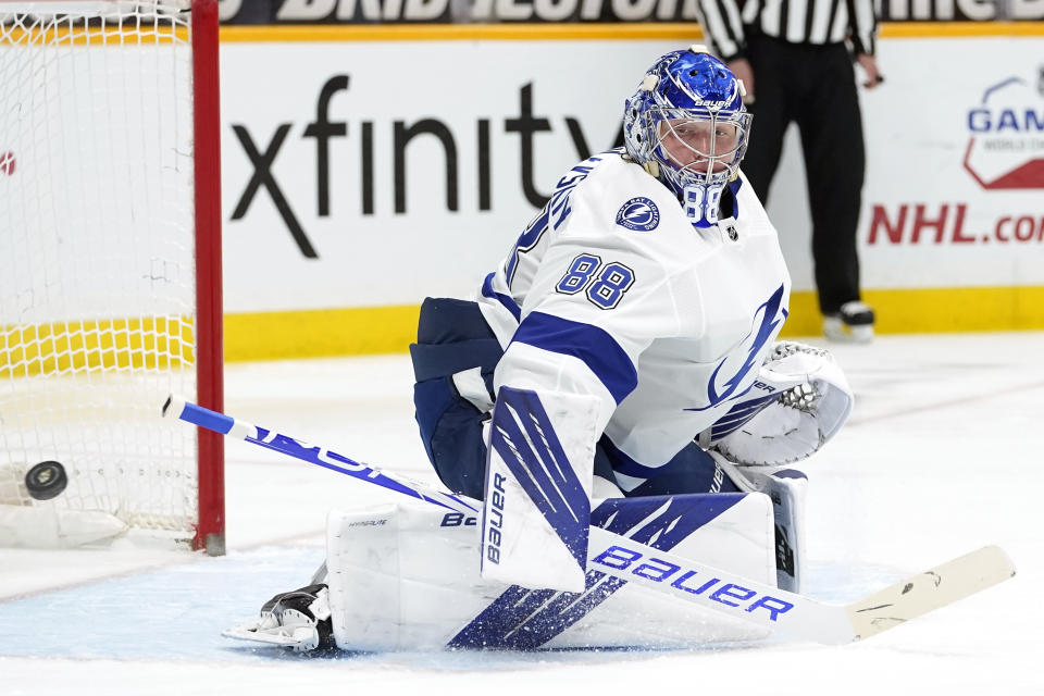 Tampa Bay Lightning goaltender Andrei Vasilevskiy blocks a shot against the Nashville Predators in the second period of an NHL hockey game Saturday, April 10, 2021, in Nashville, Tenn. (AP Photo/Mark Humphrey)