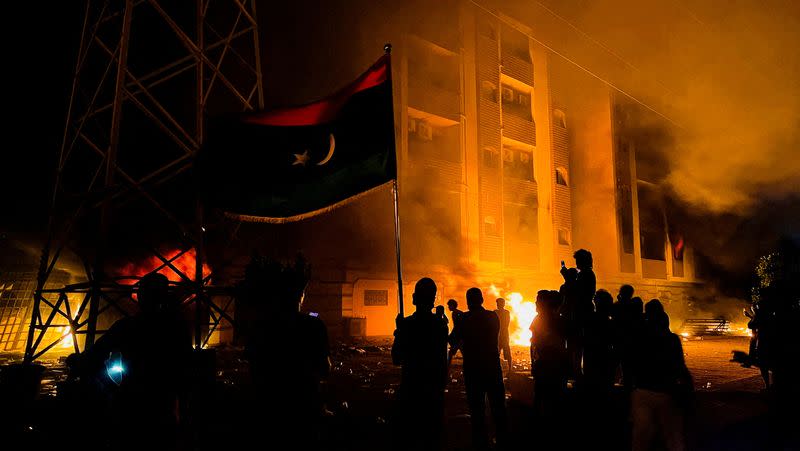 FILE PHOTO: Protesters set fire to the Libyan parliament building after protests against the failure of the government in Tobruk