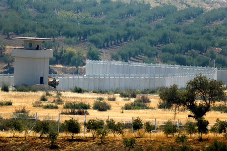 A wall along the border between Turkey and Syria is pictured near the southeastern town of Deliosman in Kilis province, Turkey, August 29, 2016. REUTERS/Umit Bektas/File Photo