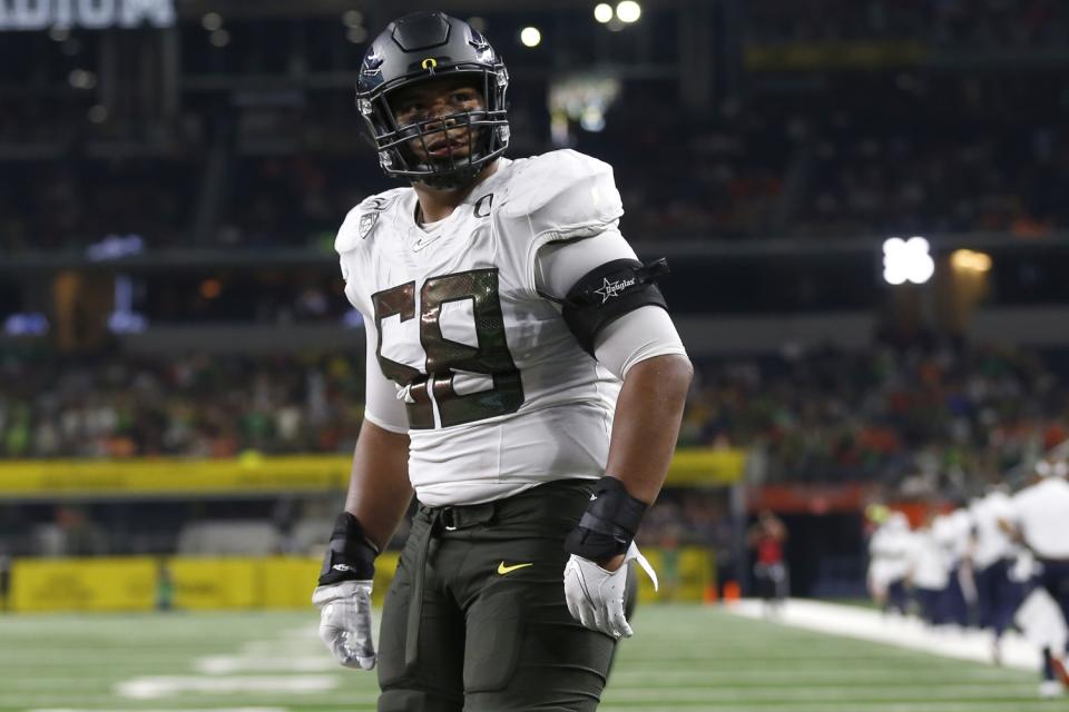 Oregon offensive lineman Penei Sewell looks on as Oregon plays Auburn.