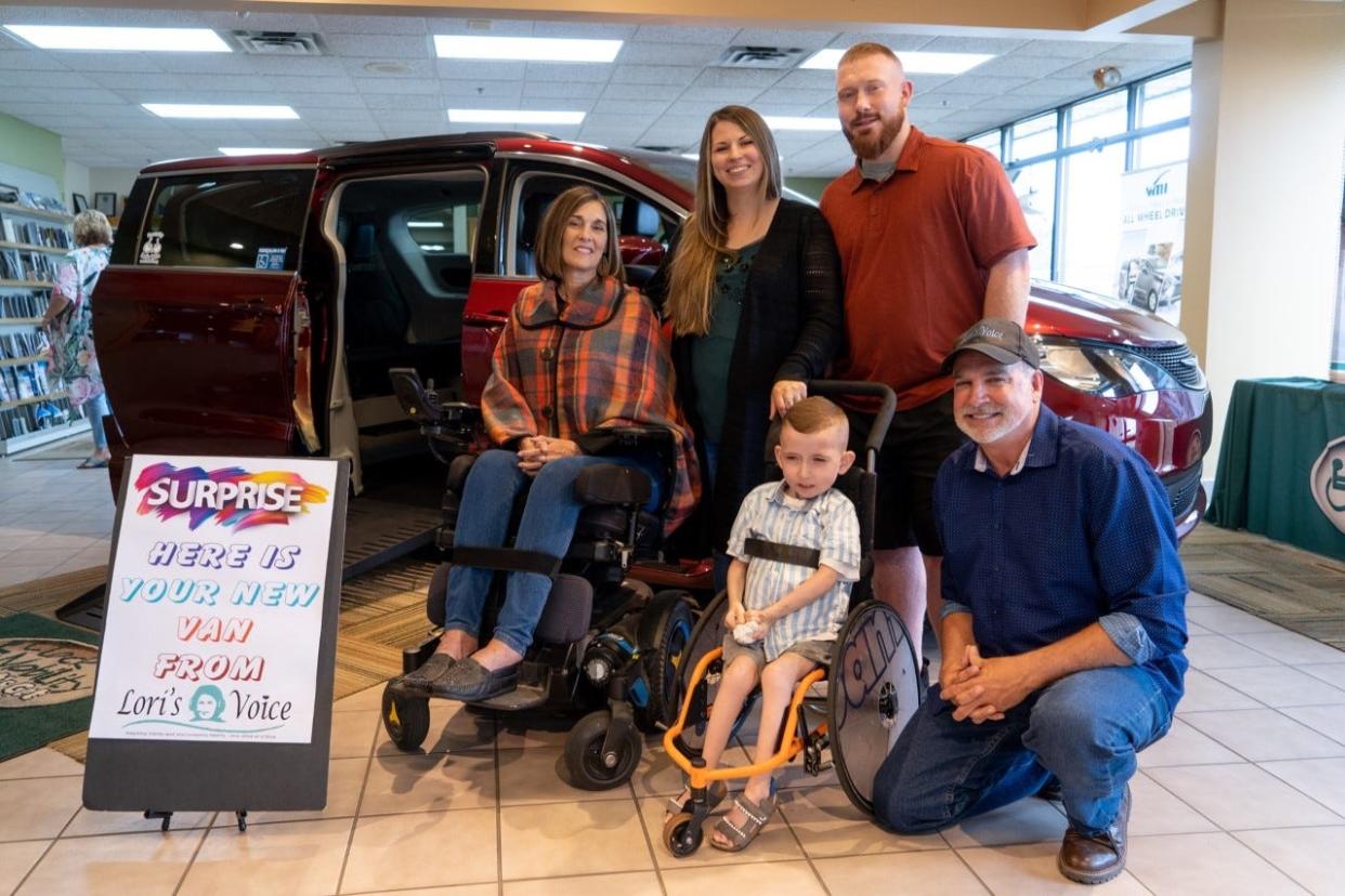 The Vincent family receives a wheelchair accessible van from Lori's Voice co-founders, Lori and Dave Hastings, on June 8, 2022. Pictured in front, from left, are Lori Hastings, Jace Vincent and Dave Hastings. In back are Jordon and Justin Vincent.