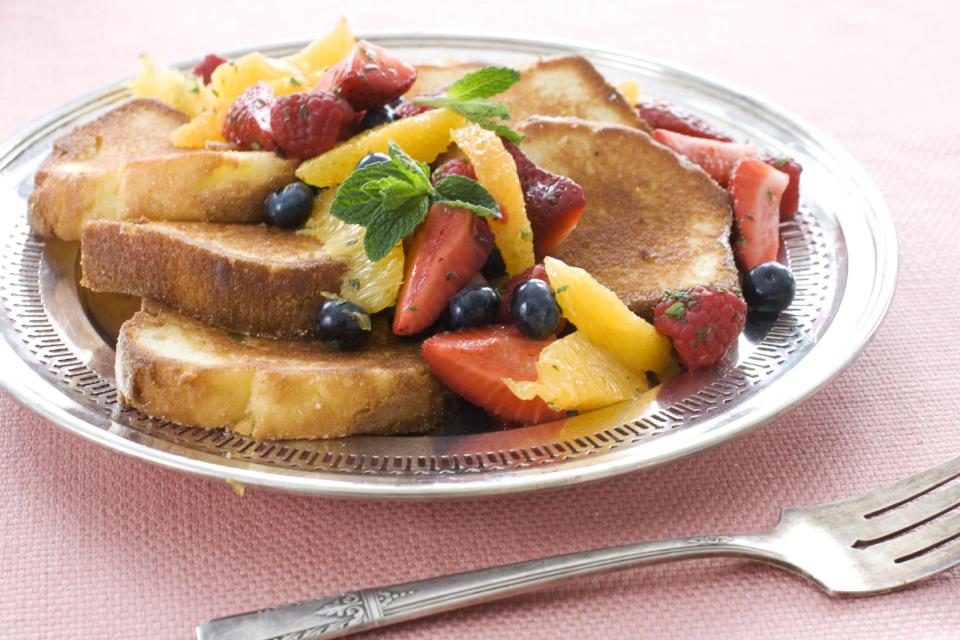 In this image taken on March 11, 2013, pan-seared pound cake with minty fruit salad is shown served on a plate in Concord, N.H. (AP Photo/Matthew Mead)