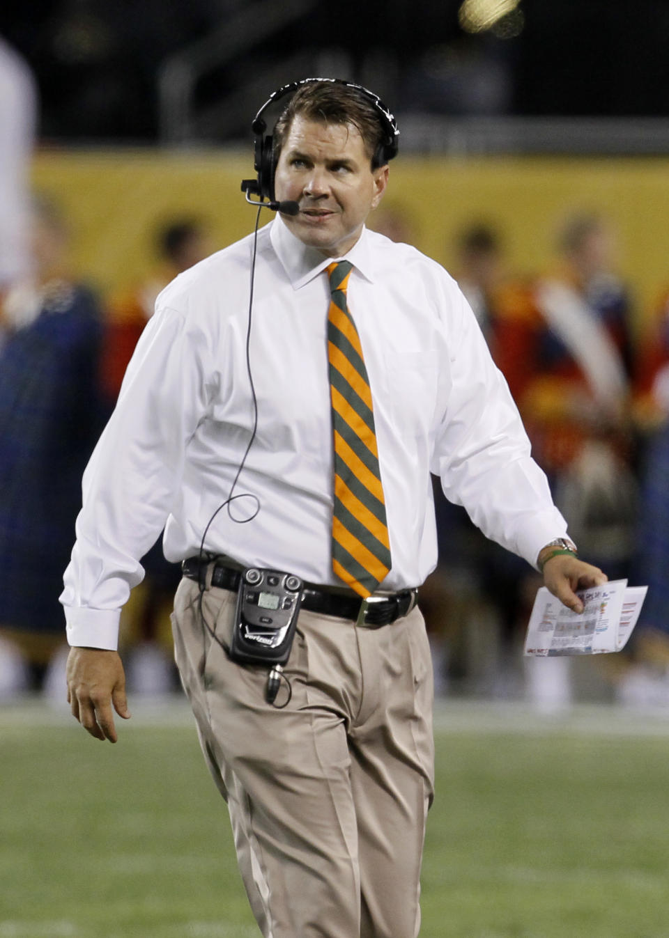 FILE - In this Oct. 6, 2012, file photo, Miami head coach Al Golden appears during the first half of an NCAA college football game against Notre Dame at Soldier Field in Chicago. Golden's crisp white dress shirt and a sharp orange tie make him arguably the best dressed coach in the college game. He played for the late Joe Paterno at Penn State, himself one of the last throwbacks to the jacket-and-tie set. (AP Photo/Charles Rex Arbogast, File)