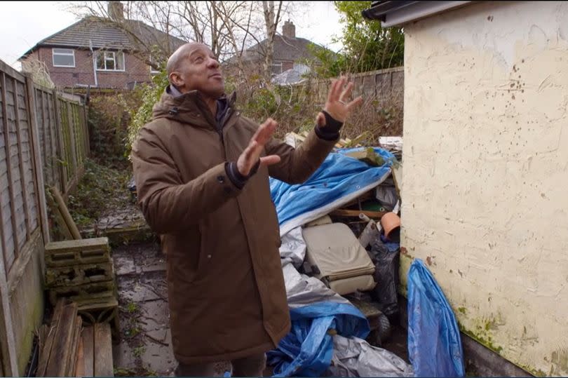 Dion Dublin in the back yard and garden of the mid-terrace in Bucknall purchased by property developer Cos