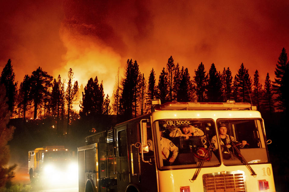 Firefighters arrive at Frenchman Lake to battle the Sugar Fire, part of the Beckwourth Complex Fire, burning in Plumas National Forest, Calif., on Thursday, July 8, 2021. (AP Photo/Noah Berger)