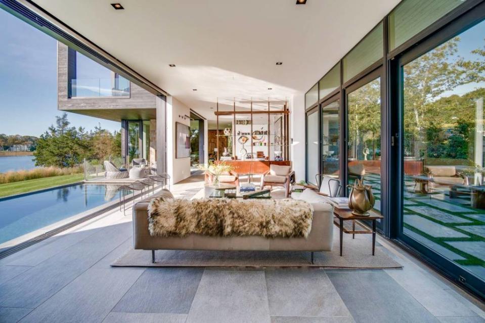You can rent this high-design home at 26 Harbor Drive in Sag Harbor — filled with midcentury finds and a window wall in the living room that opens to the pool — for $850,000 a year. Trevor Tondo
