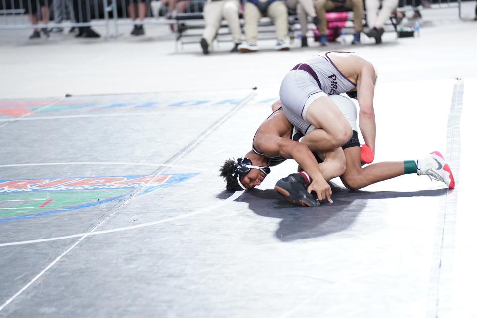 Mariner's Christopher Minto wrestles in the 160-pound Class 2A state final on Saturday in Kissimmee.