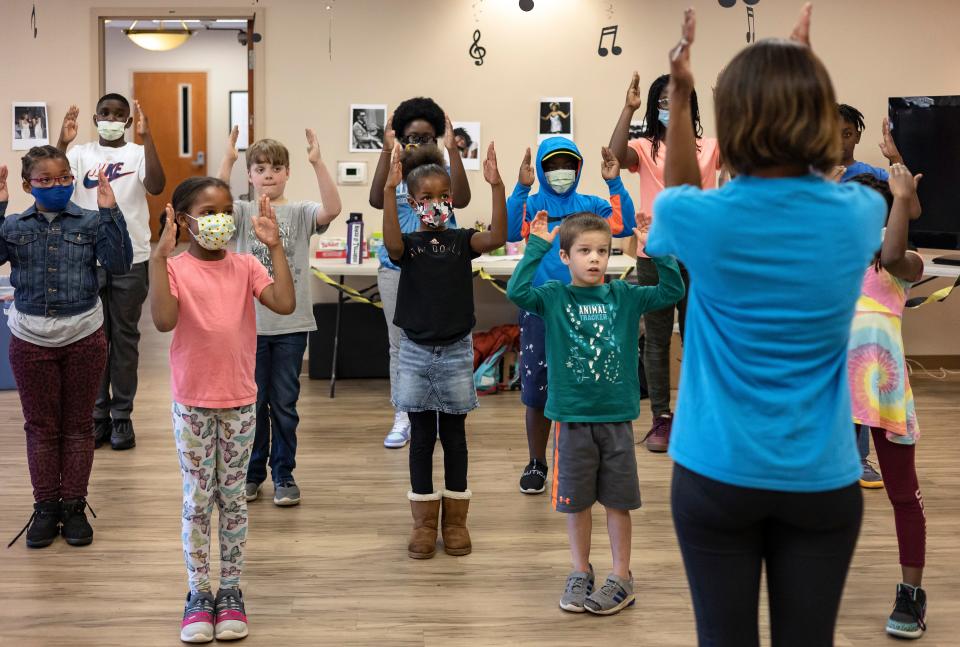 Chantal Brown, vice president of League of Step, leads children in a series of step-dancing moves during the first day of the two-day Joy Village School music Ccamp on Monday, Nov. 22, 2021, in Athens. The camp, consisting of about 25 students grades K-8, featured multiple play-based learning activities with a focus on the history of Black music.