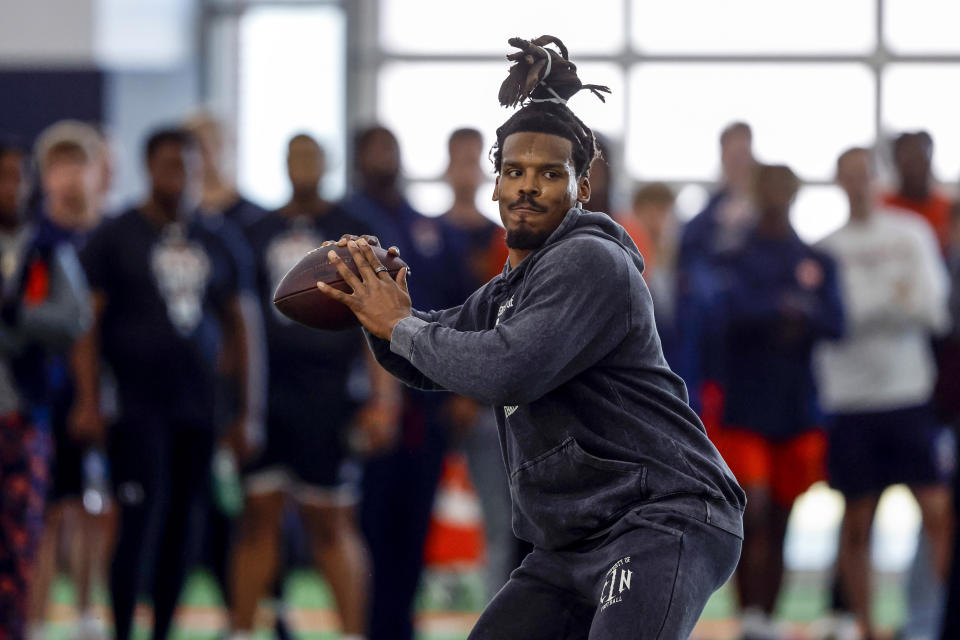 Former NFL and Auburn quarterback, Cam Newton, throws a pass during Auburn Pro Day, Tuesday, March 21, 2023, in Auburn, Ala. (AP Photo/Butch Dill)