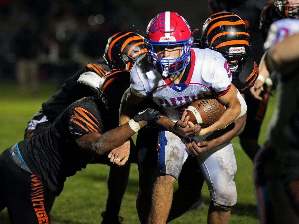 Licking Valley's Luke Conaway breaks through the East defense on Friday.