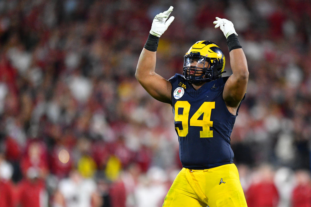 PASADENA, CA - JANUARY 01: DL Kris Jenkins (94) of the Michigan Wolverines tries to pump up the crowd in overtime of the Alabama Crimson Tide game versus the Michigan Wolverines CFP Semifinal at the Rose Bowl Game on January, 1, 2024, at the Rose Bowl Stadium in Pasadena, CA. (Photo by Brian Rothmuller/Icon Sportswire via Getty Images)