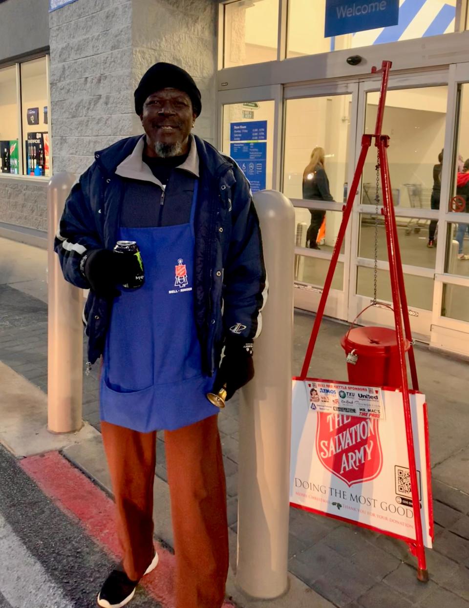 Volunteer Leroy Page patiently rings as donations are received towards Salvation Army's $150,000 goal.