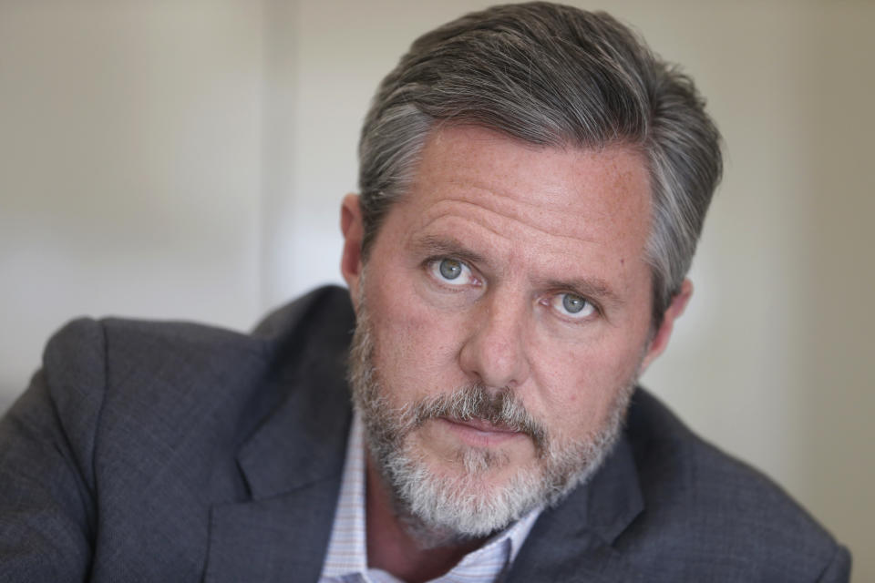 FILE - In this Nov. 16, 2016, file photo, Liberty University president Jerry Falwell Jr., poses during an interview in his offices at the school in Lynchburg, Va. In light of the coronavirus pandemic, Virginia's governor asked Falwell on Wednesday, March 25, 2020, to reconsider his decision to welcome students back to the Lynchburg campus this week after their spring break. (AP Photo/Steve Helber, File)