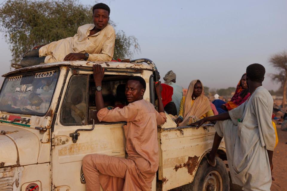 PHOTO: Newly arrived refugees from Darfur in Sudan sit on a vehicle before being taken to a new camp on April 24, 2024 in Adre, Chad.  (Dan Kitwood/Getty Images)