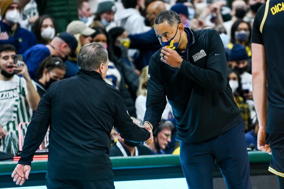 Michigan State's head coach Tom Izzo, left, and Michigan head coach Juwan Howard shake hands after the game on Saturday, Jan. 29, 2022, at the Breslin Center in East Lansing.