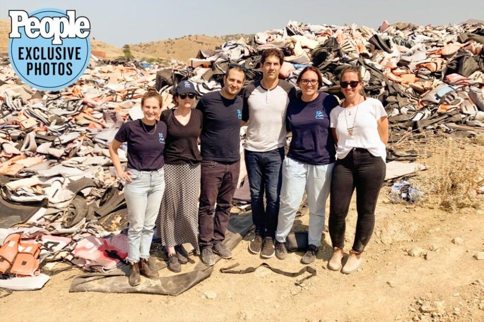 Sheryl Sandberg (second from left) and Tom Bernthal (third from right) visiting a refugee camp in Lesbos, Greece | Larissa Cleveland