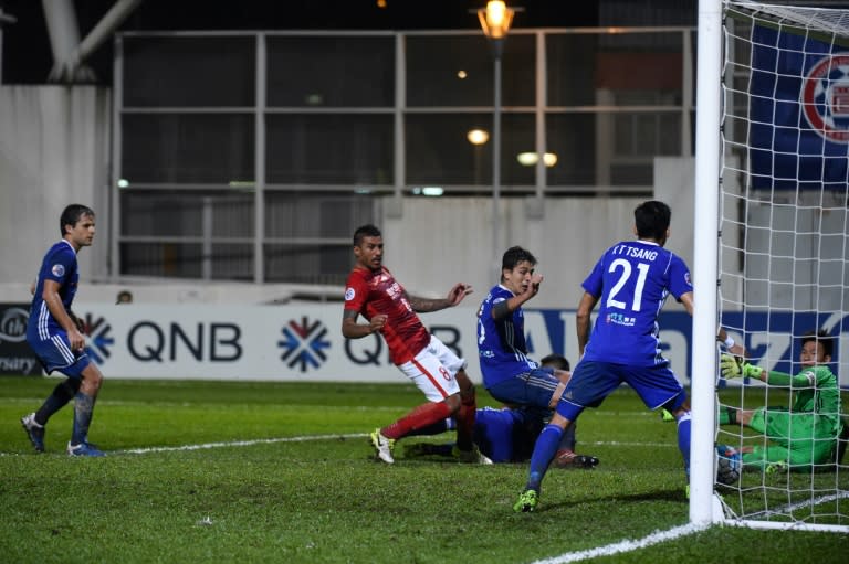 China's Guangzhou Evergrande's midfielder Paulinho (C) scores a goal against Hong Kong's Eastern on April 25, 2017