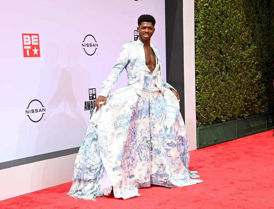 Lil Nas X wears a suit-style dress for the 2021 BET Awards.