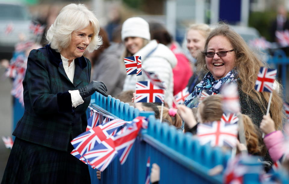 Britain's Camilla, Duchess of Cornwall, gestures as she arrives at the Roundhill Primary School in Bath, Britain, February 8, 2022. REUTERS/Peter Nicholls/Pool