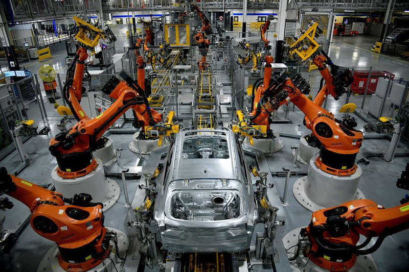 FILE PHOTO: Autonomous robots assemble an X model SUV at the BMW manufacturing facility in Greer